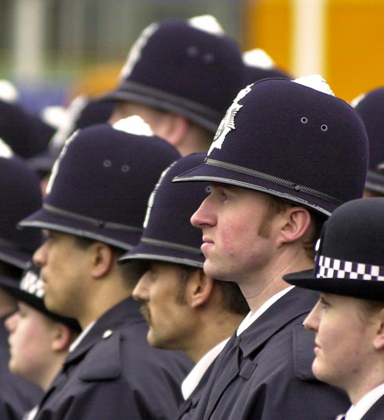 Line of police people in helmets
