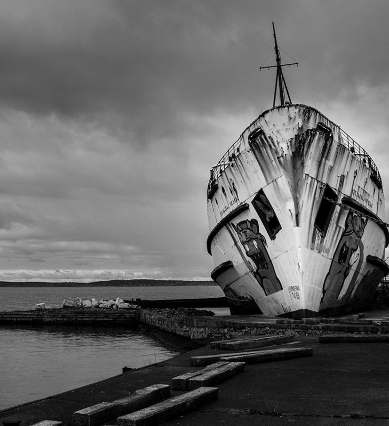 Rusty ship in a ship yard